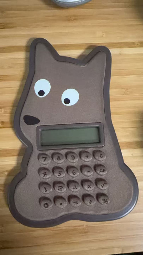 Cute cartoon dog shaped solar calculator - brown dog design with big eyes