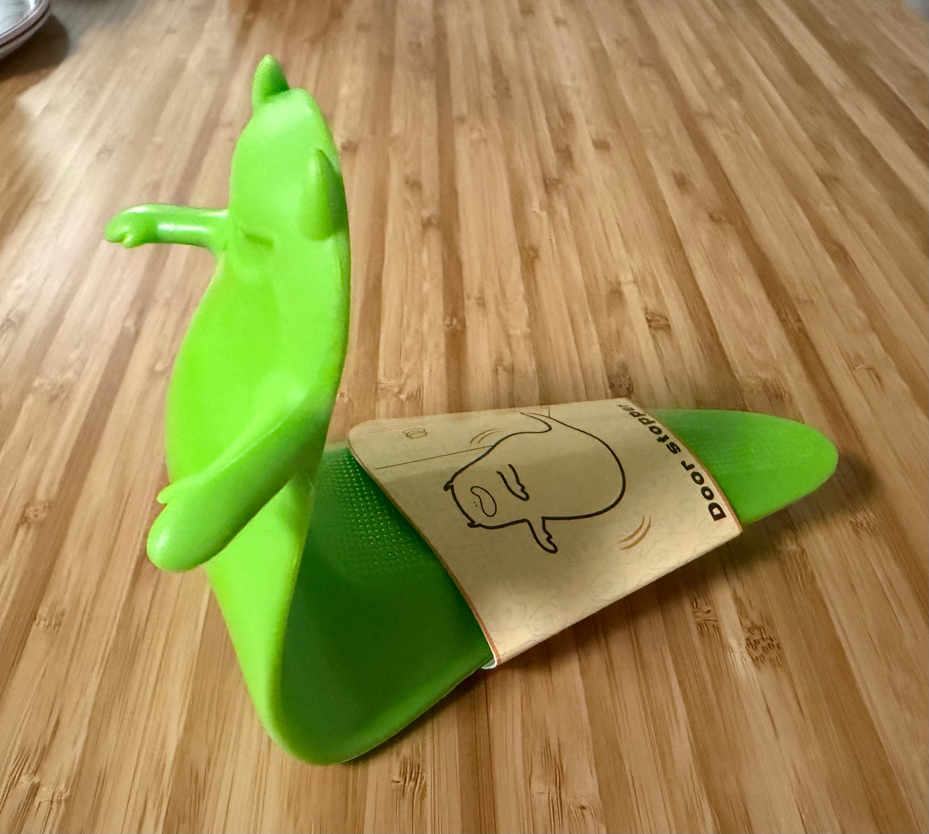 Green Halloween Ghost Door Stopper - side view showing door stopper function