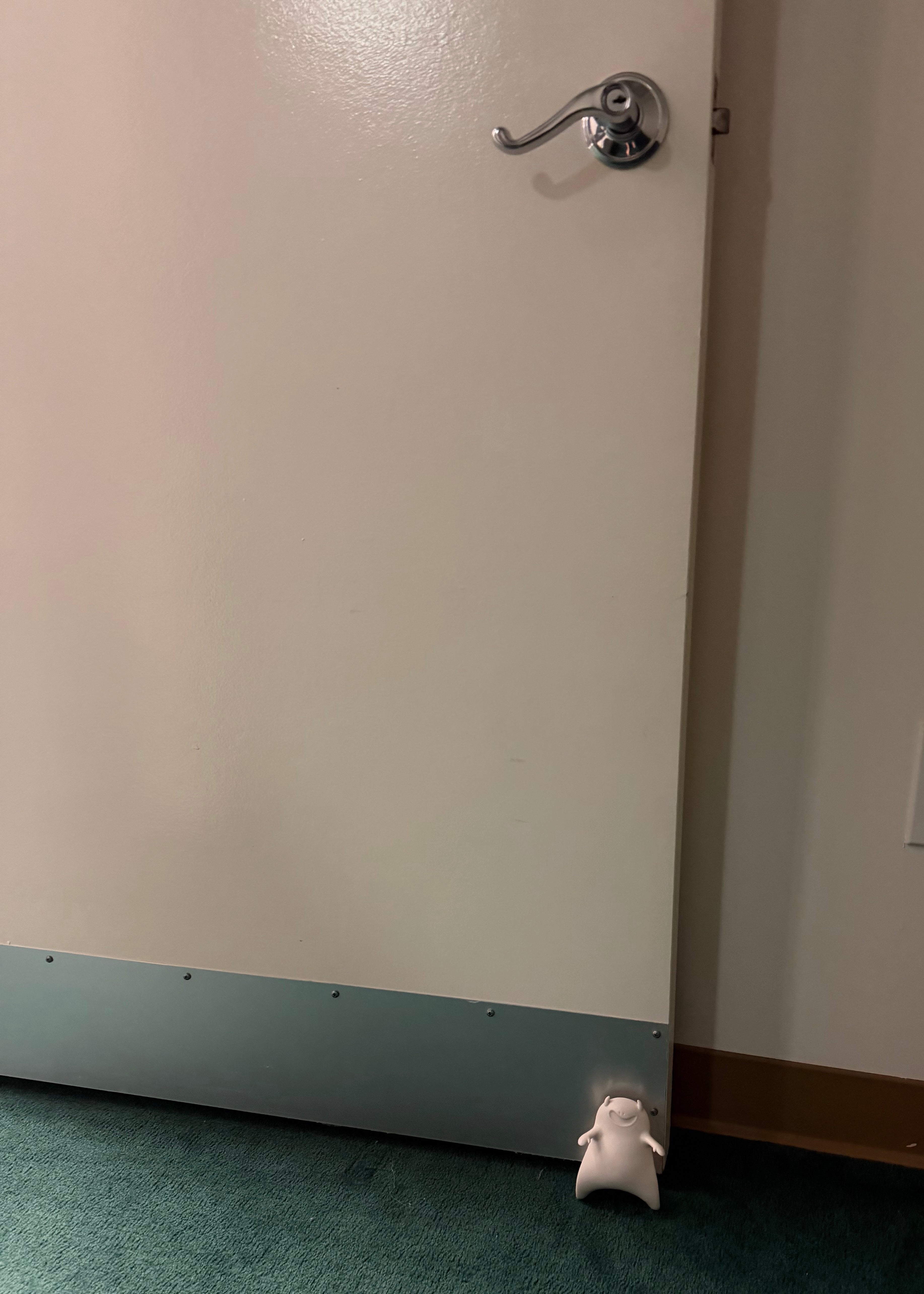 White Halloween Ghost Door Stopper in use - holding door open